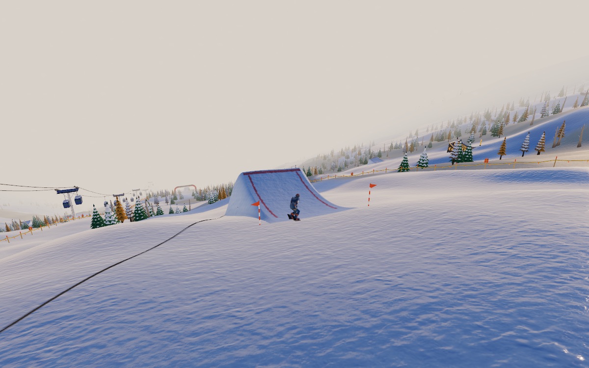 A rider approaching a kicker at dawn, a winch cat's steel cable crossing the run toward it, ropes along both sides