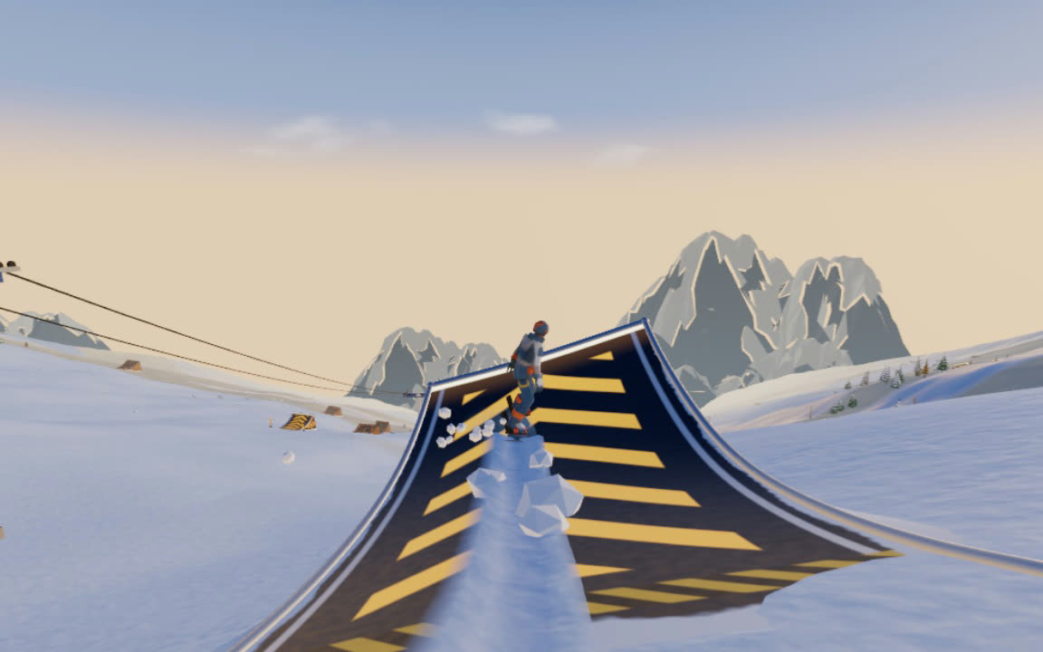 A snowboarder riding up a graphite booster kicker painted with gold chevrons, a gondola tower beside it